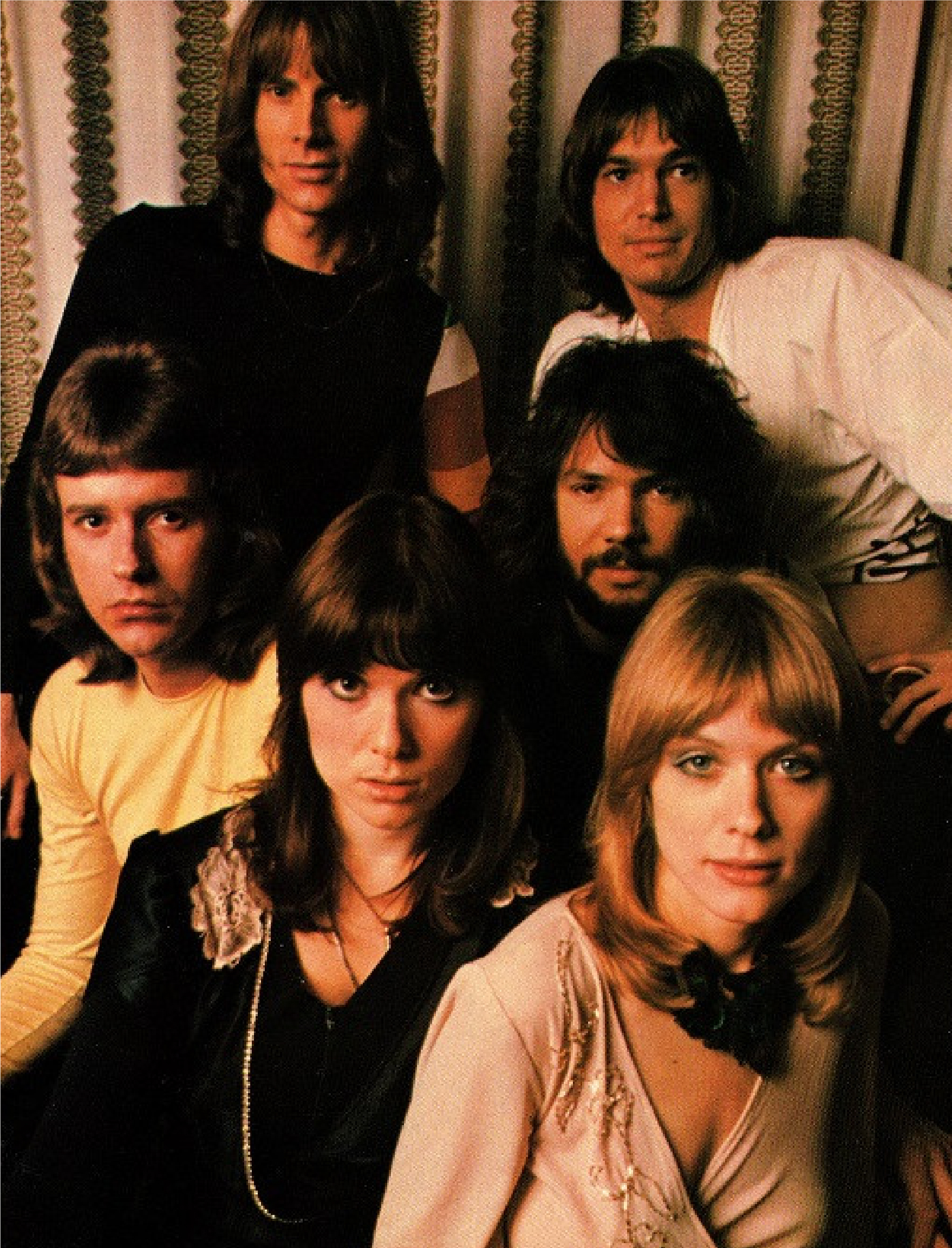 70's vertical photoshoot photo of the band, Ann and Nancy in the foreground