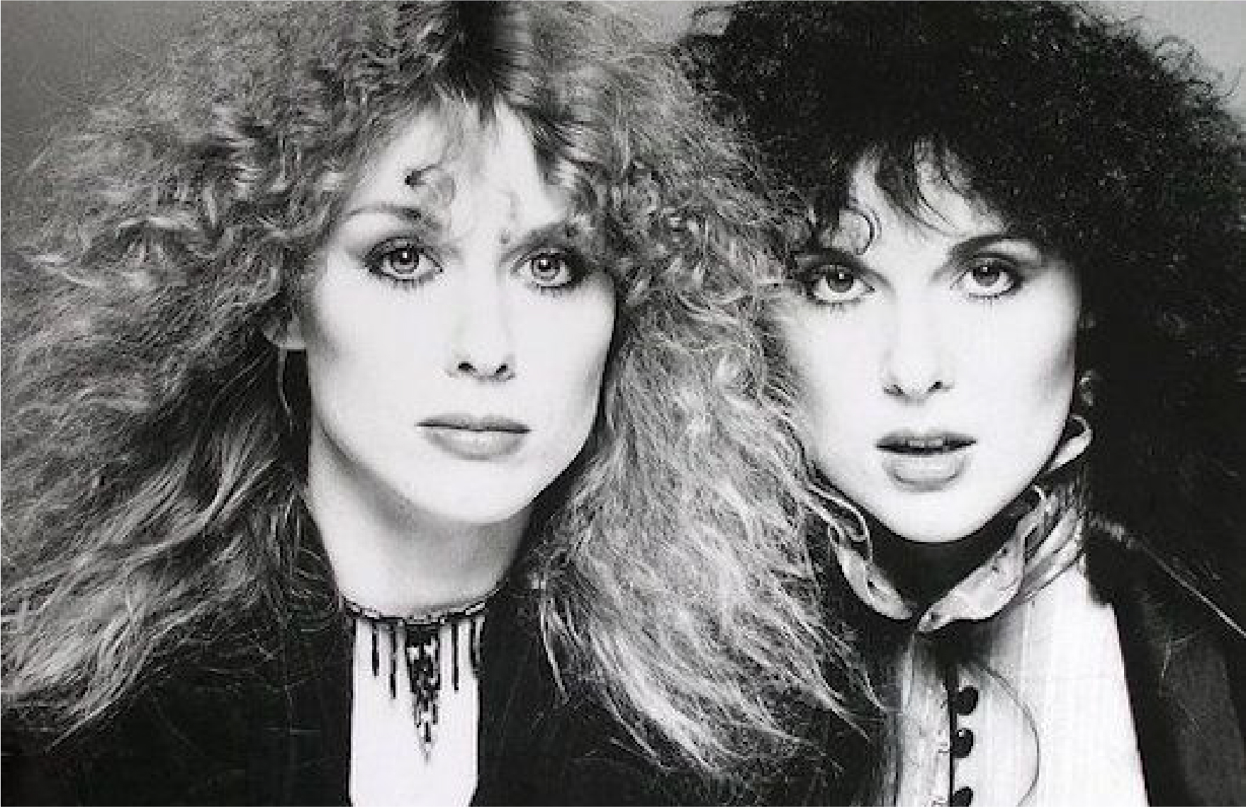 80's side-by-side serious protrait of the sisters