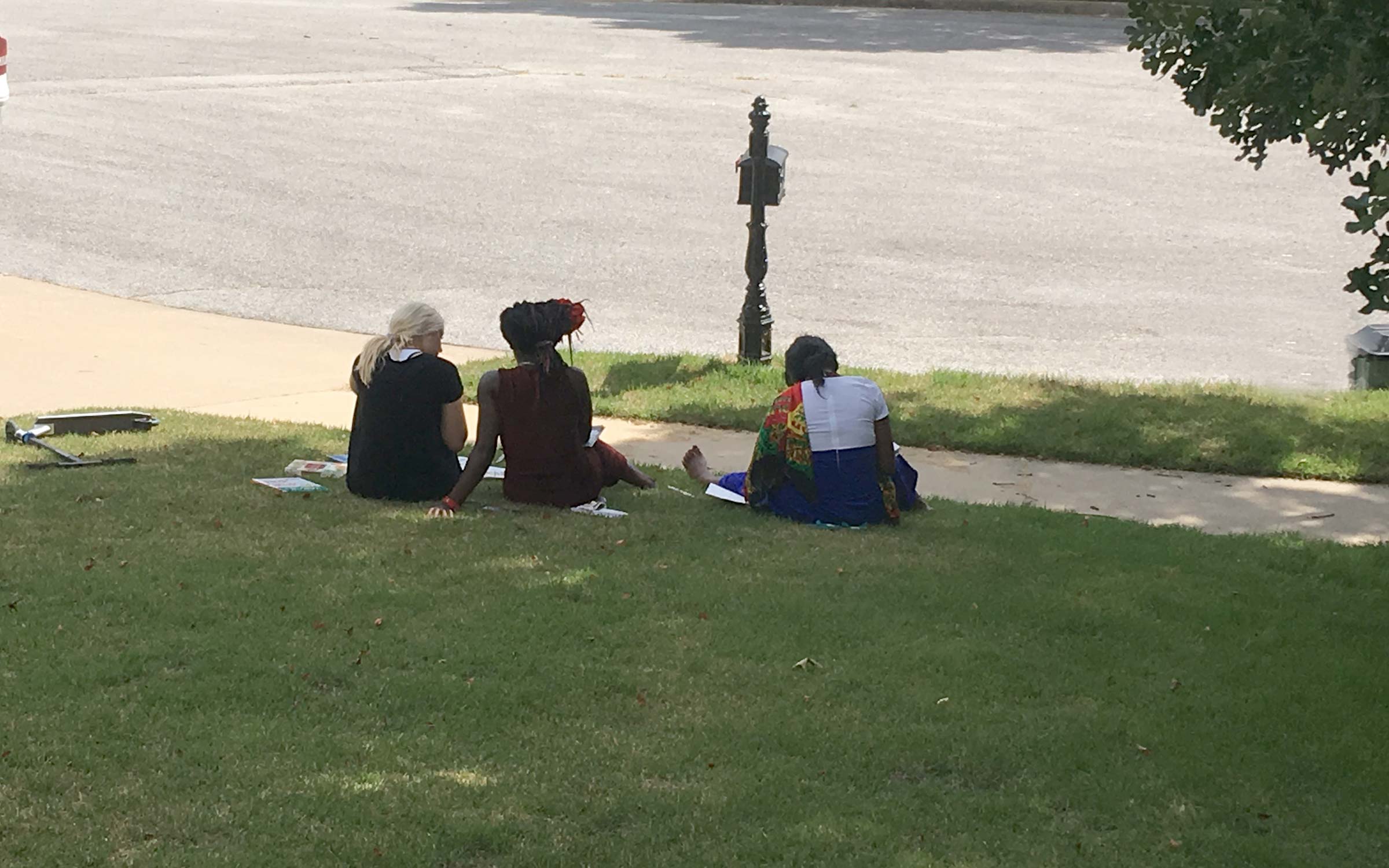 My daughter teaching English in the front yard to new Swahili-speaking friends