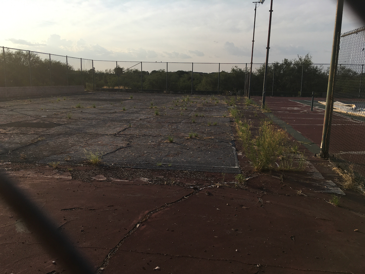 The abandoned tennis courts in Arizona where I learned how to play. Hopefully, not reflective of my present game.
